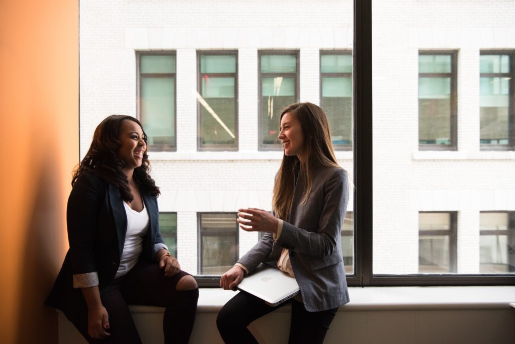 Two co-workers in an inclusive work environment.